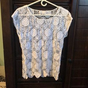 White flower pattern shirt.